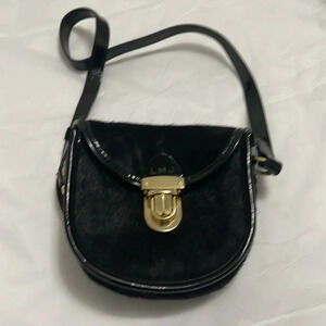 Little Marc Jacobs calf hair mini in black. Patent leather accents.